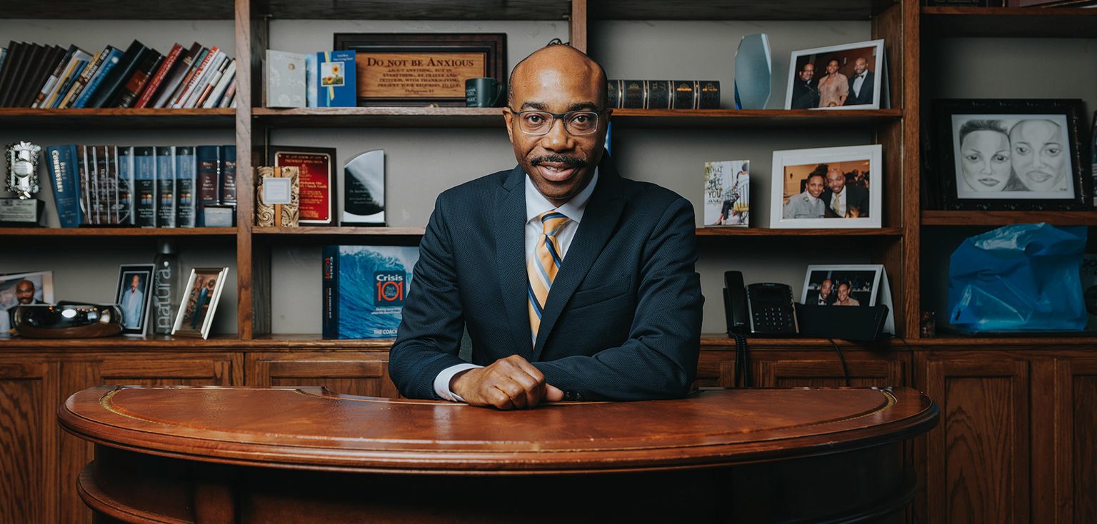 Dr. Orr seated at his desk in his office